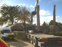 Using hiab to dismantle, lift & remove large pine stems from site in Great Ayton